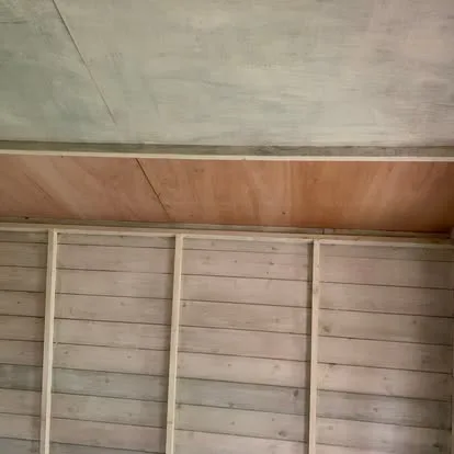 New roof boarding fitted between sound existing summerhouse boards