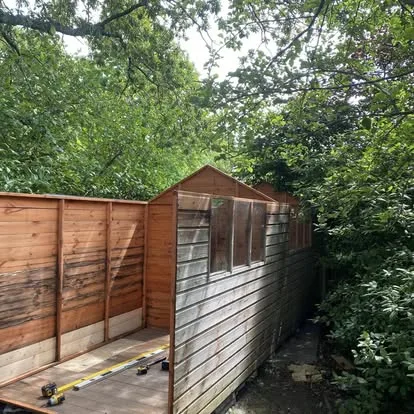 Long timber workshop during a side-wall and window rebuild