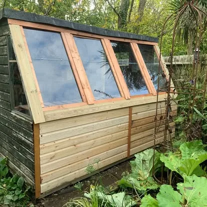 Exterior view of the completed and sealed potting-shed window bank