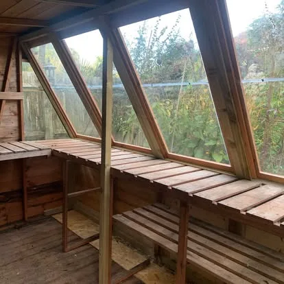 Interior view through the restored potting-shed glazing