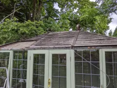 The same summerhouse roof before repair