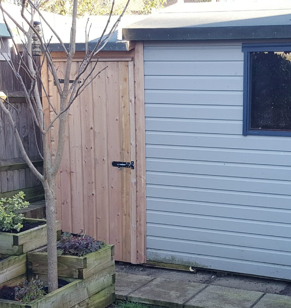 Tall timber garden building repair