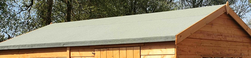 Finished garden-building roof with fitted edge trims